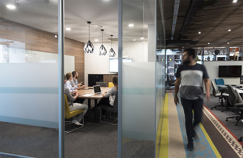 Interior view of a startup business with coworkers seen during a commercial property inspection